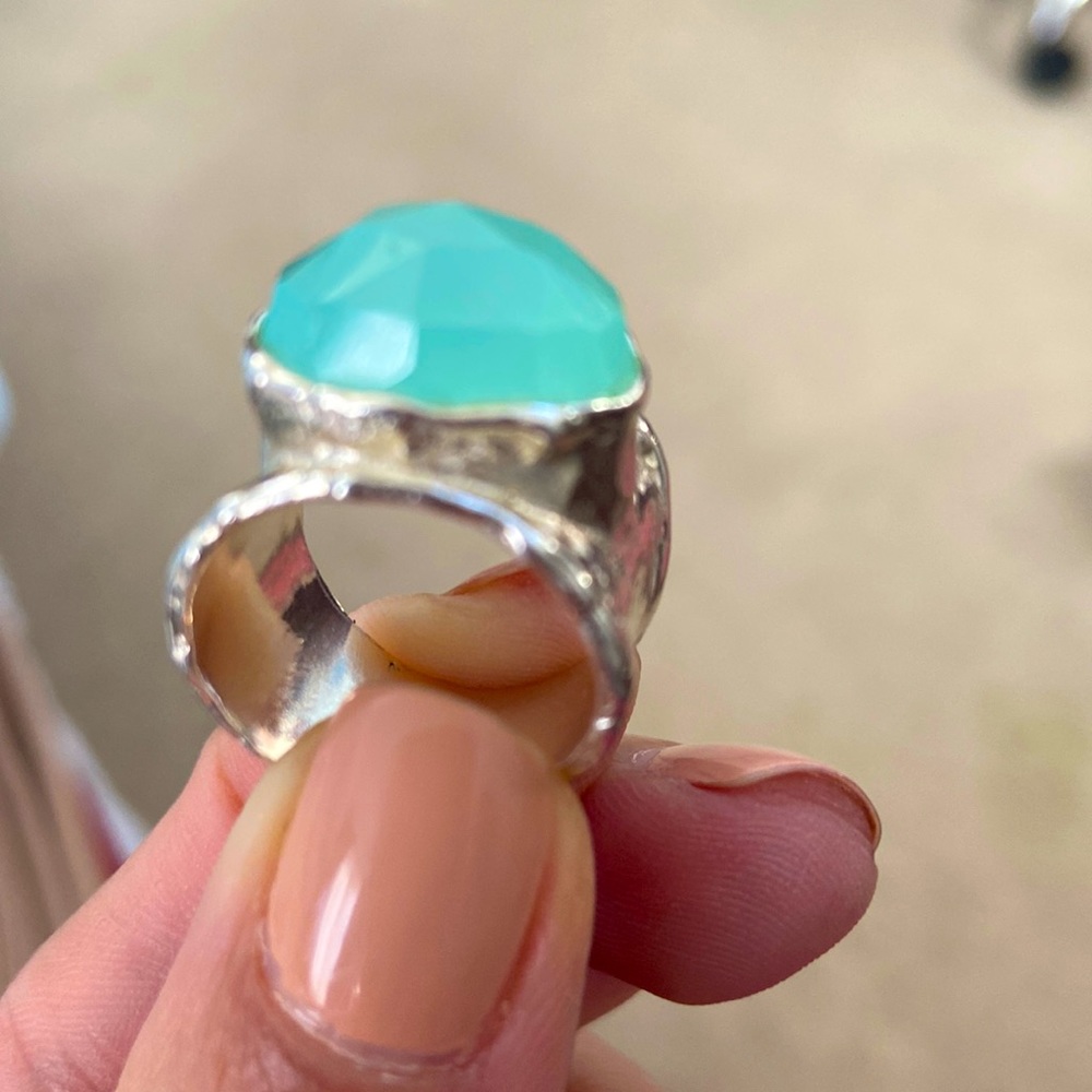 Silver with a mint color stone